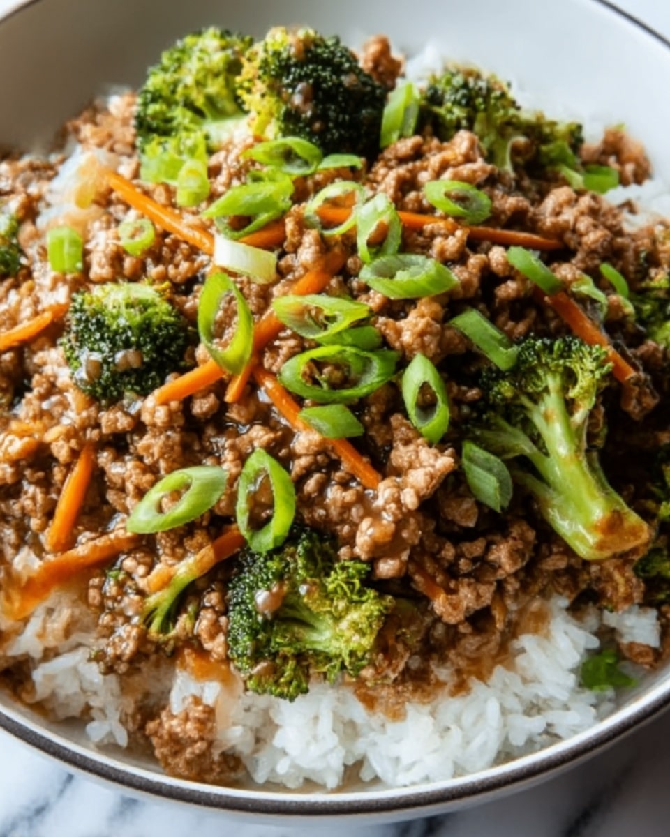 A bowl of cooked white rice forms the bottom layer, topped with a layer of cooked ground meat mixed with small pieces of broccoli florets and thin orange carrot strips. The meat mixture is covered with a light sauce giving it a glossy texture. Freshly sliced green onions are sprinkled on top, adding a bright green color to the dish. The food is served in a white bowl on a white marbled surface. photo taken with an iphone --ar 4:5 --v 7