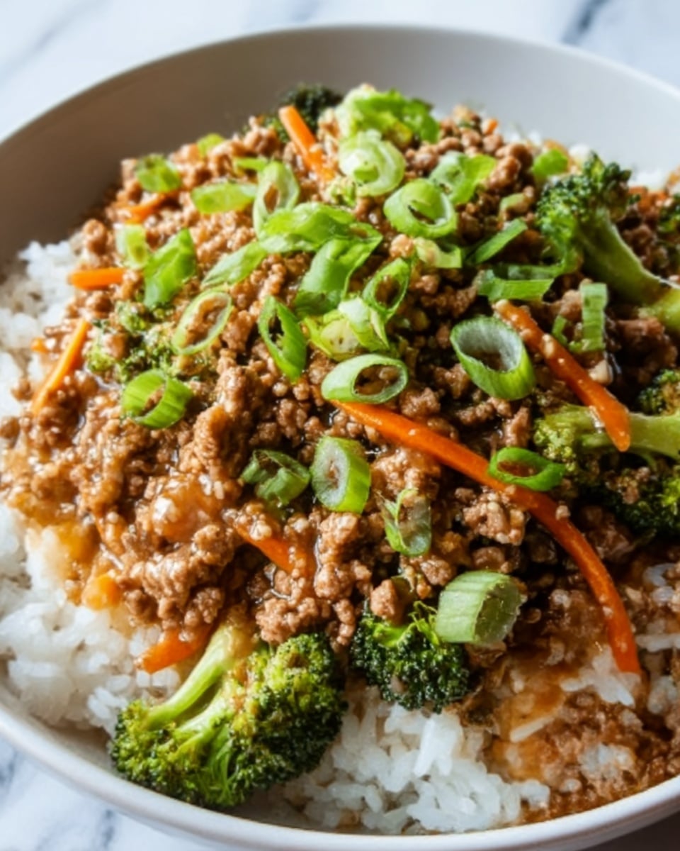 A white bowl filled with three main layers: at the bottom is a thick bed of white rice with a soft texture, topped with a layer of cooked ground meat in a brown sauce that looks slightly glossy, mixed with small green broccoli florets and thin orange carrot strips. The dish is finished with a sprinkling of chopped green onions evenly scattered on top, adding a fresh green color contrast. The background features a white marbled surface, creating a clean, bright setting. Photo taken with an iphone --ar 4:5 --v 7
