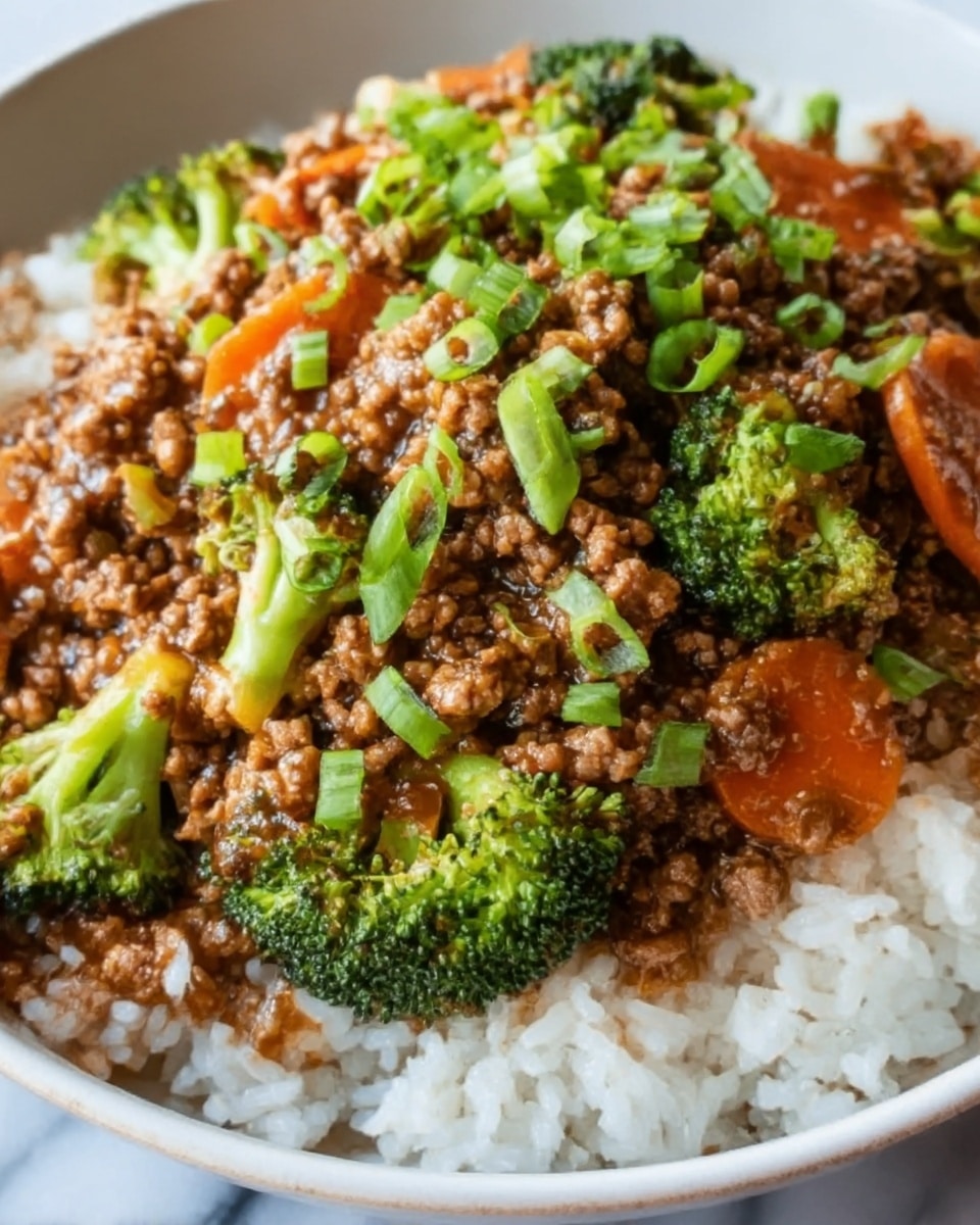 A close-up image of a bowl filled with a layered dish starting with white rice at the bottom, topped with cooked minced meat mixed with small pieces of green broccoli and thin orange carrot strips. The minced meat layer is brown and slightly shiny, covered with a sprinkle of chopped green onions adding a fresh green color on top. The bowl is white, placed on a white marbled textured surface. photo taken with an iphone --ar 4:5 --v 7